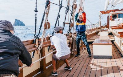 Guests hoisting sails on Florette